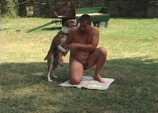 Naked male zoofil plays with his doggy