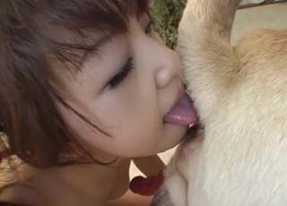 Redhead Asian model is licking her doggy's big ass