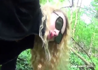 Blonde in sexy shades needs dog in the woods