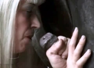 Sexy blonde sucking a juicy stallion dick